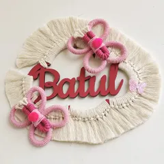 A client wanted a butterfly theme instead of a rainbow for this name hanging, and I loved the idea. This piece for "Batul" features two pink macrame butterflies.