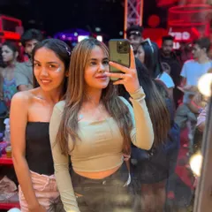 A selfie in the mirror at my glitter bar. It's a fun, interactive space where guests can hang out and get ready together.