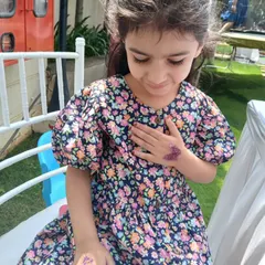 This little one is admiring her new purple butterfly glitter tattoo. It’s always a wonderful moment when a child sees their finished design for the first time.