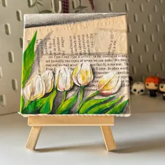The finished white tulip mini canvas, resting on a tiny easel. This piece combines my love for florals and vintage aesthetics.