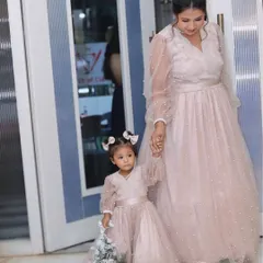 Create precious memories with my custom mom-daughter twinning outfits. This matching set of pearl-studded pink gowns is perfect for birthdays, parties, or any event where you want to share a special style moment with your little one.