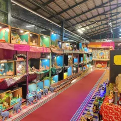 A view of our annual Dhaatu Navarātra Mahotsava. The entire hall is transformed into a landscape of stories, with thousands of dolls arranged in intricate dioramas that depict scenes from our epics and the vibrant life of Bharat.