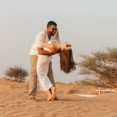 A spontaneous dip and a shared laugh in the middle of the desert. These are the candid, action-filled shots that bring a couple's fun-loving personality to life.