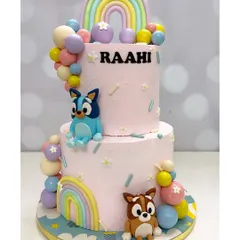 For the little Bluey fans! This two-tier cake brings the playful world of Bluey and Bingo to life with colorful rainbows, fluffy clouds, and adorable, handcrafted character toppers. It was so much fun to make for Raahi's birthday.
