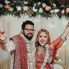 Pure celebration! This photo captures the couple's ecstatic energy right after their ring ceremony. Their joyful expressions and triumphant poses say it all.