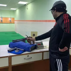 This shooter is demonstrating excellent form, keeping his body stable and his focus locked on the target. This is the result of consistent practice and dedication to the fundamentals.