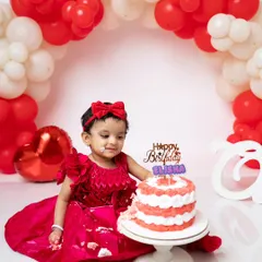 A little bit of frosting on her face, this shot captures the beginning of the messy fun.