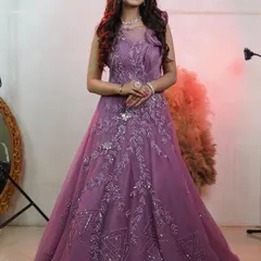 This angle highlights the delicate pleating and shimmering embellishments on the gown's bodice. It’s these small, high quality details that make an outfit look luxurious on camera and elevate the overall quality of your work.