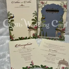 A classic design featuring the timeless beauty of peacocks and traditional Indian architecture. The main card has a beautiful laser-cut window, and the accompanying inserts carry the floral and peacock motifs throughout the suite.