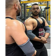 A moment of focus. Assessing my physique in the mirror helps me track progress and stay motivated. This is about being better than I was yesterday.
