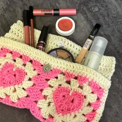 Here’s the heart granny square pouch filled with makeup to give you an idea of its size. It’s a stylish way to keep your bag organized.