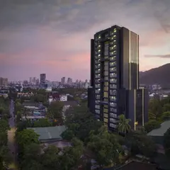 A commercial tower in Thane, designed to be modern, elegant, and sharp. As dusk settles, the building's facade glass blends with the sky, while integrated vertical light strips create a striking ambiance, accentuating its strong presence in the urban landscape.