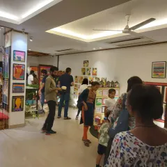 A wide shot of the bustling crowd at our 30th-anniversary exhibition. It was a wonderful day filled with art, conversation, and celebration.