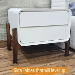 This modern side table combines a clean white body with curved edges and beautifully crafted solid wood legs. It's a perfect example of minimalist design with a warm touch.