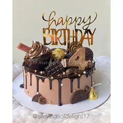 For the ultimate chocolate lover, this is my Chocolate Overload drip cake. It's a rich chocolate cake topped with more chocolate, including Ferrero Rocher, Oreos, chocolate bars, and a whole cupcake.