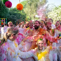 The vibrant chaos of a Holi celebration. This group shot captures the joy and energy of friends covered in colors.