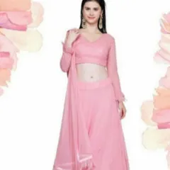 This classic pink lehenga features a full-sleeved blouse with delicate embroidery and a simple, flowing skirt. It's a timeless and graceful outfit suitable for a variety of traditional ceremonies and family functions.