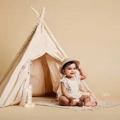 The Boho Teepee theme uses natural textures and a neutral color palette for a soft and artistic feel. It’s perfect for creating serene and beautiful first birthday milestone portraits.