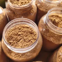 The rich, earthy texture of my Chocolate Ubtan. It's a versatile product that can be used as a face pack, a body cleanser, or a gentle scrub.