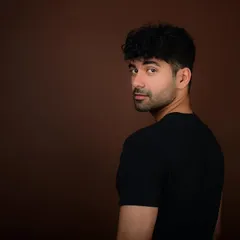 A classic actor's headshot with a look over the shoulder. This intense and direct gaze is exactly what casting directors look for, showing a range of emotion with just a glance.