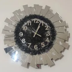I love how this sunburst wall clock turned out! It's a real statement piece, made with a mix of sparkling crushed glass and mirrored accents to catch the light beautifully. We can customize the colors to match your living room decor.