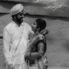 A timeless black and white portrait of a couple sharing a happy, loving gaze. This style emphasizes their expressions and the joy of the moment.