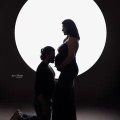 A timeless silhouette portrait that speaks volumes without a word. I love using dramatic lighting to focus on the beautiful connection between a couple and the new life they are waiting for.