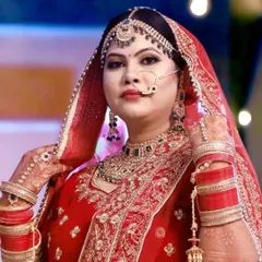 A classic Indian bride in a traditional red lehenga. I aimed for a timeless and graceful look, with perfectly defined features and makeup that complements her beautiful jewelry and outfit for her main wedding day.
