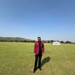 A full-length shot of Mr. Singal, showcasing his confident stance and the impeccable fit of his bespoke jacket and trousers.