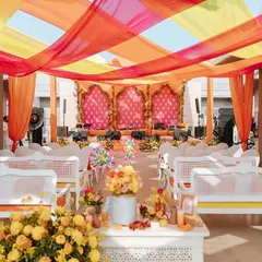We brought the vibrant spirit of a traditional Indian Mela to life for Neomi and Rakshit's 'Jaipur Wali Haldi'. The space was bursting with bright oranges, pinks, and yellows, complete with colorful drapes and festive seating to create an atmosphere of pure joy.