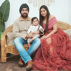A stylish family portrait in my studio. I offer a selection of beautiful gowns for moms to wear, so you can feel your best during the shoot.
