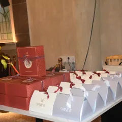 A detailed look at the themed gift boxes we created for the Gladia launch. The combination of red boxes and silver bags, tied with custom ribbons, created a sophisticated and cohesive look that matched the event's Roman theme.