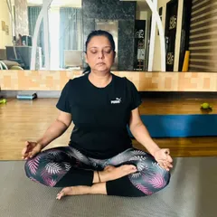 A student in a deep state of meditation during a home visit. Our personalized sessions create a peaceful and focused environment for you to connect with your inner self.
