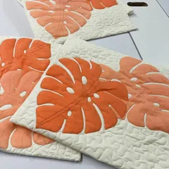 A set of three monstera leaf cushion covers, showcasing a consistent and stylish design for home decor.
