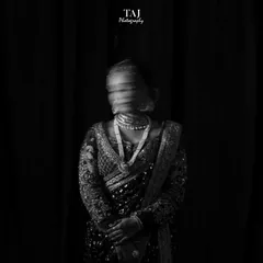 A wider view of the motion blur portrait. The black and white edit enhances the mysterious and artistic quality of the shot, making it a unique and memorable bridal photo.