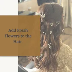Adding fresh flowers to your hair is a timeless way to complete a traditional Indian outfit. It brings a natural and graceful element to your overall festive appearance.