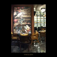 This large-scale oriental pop art piece at Shanghigh creates a dramatic focal point in the dining area. The artwork blends traditional motifs with a contemporary, graphic style.