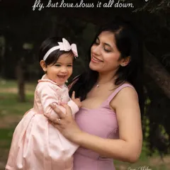 Moments like this remind us that while time may fly, love slows it all down. A mother's gentle hold and a shared smile with her daughter during her first birthday outdoor shoot.