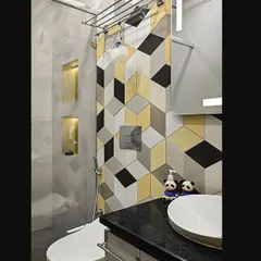 Even a kid's bathroom can be stylish. I used playful 3D geometric tiles in yellow, black, and white to create a fun and energetic feature wall in this bathroom.