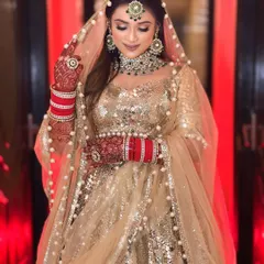 This look is all about glamour. The heavy gold sequin work paired with a pearl-bordered dupatta creates a stunning contrast. It’s an outfit designed to make you shine.