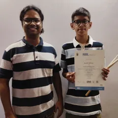 We're thrilled for Kabir, who passed his RSL debut drums exam with distinction. Here he is with his teacher Shreyash, celebrating a job well done.