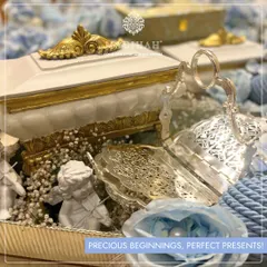 "Precious beginnings, perfect presents!" This hamper is thoughtfully curated to celebrate the arrival of a little miracle with elegance and charm. The angelic details make it a truly special gift.