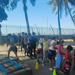 A look at our shooting line during a daytime session. Students of various ages learn side-by-side, each focusing on their own target. We ensure everyone gets ample practice time.