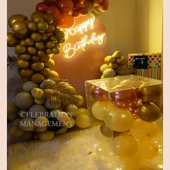 A closer look reveals the clear acrylic box filled with balloons and lights, a creative element that adds a unique flair to the setup.