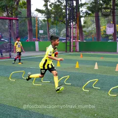 This action shot captures a player mid-stride during a hurdle drill. I focus on developing quick feet and explosive movements that translate directly into better on-field performance.