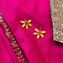 These flower-shaped earrings with a pink stone center are one of my most loved designs from the festive season. They are light, bright, and add a touch of fun.