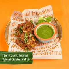My Burnt Garlic Tossed Spiced Chicken Kebab is a flavour explosion. The chicken is infused with the smoky taste of burnt garlic and served with a fresh mint chutney.