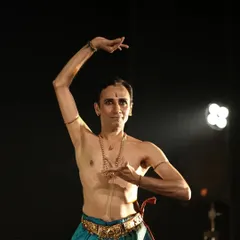 A moment of stillness and expression during the Soorya Festival. The precise hand gestures, or mudras, are a language in themselves, each one conveying a specific meaning or emotion within the story.