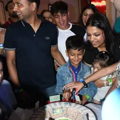 The excitement is palpable as the family celebrates Prishiv's 8th birthday with his custom cricket stadium cake.