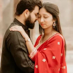 An intimate and serene portrait from a pre-wedding shoot at a historic location. The soft light and close embrace create a feeling of timeless romance.